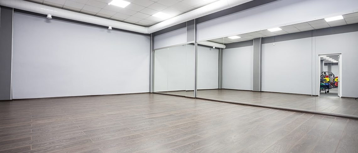Commercial wall mirror installed in dance studio